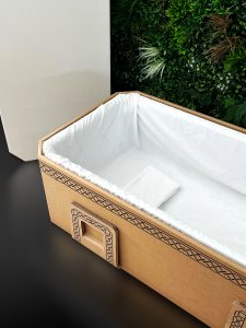 Biodegradable cardboard coffin with eco-friendly design | Eco-friendly funeral casket made from recycled cardboard | Sustainable burial solution - flat-pack coffin kit | Cardboard coffin for green funerals and cremation | Lightweight cremation coffin with waterproof lining | Customizable eco coffin with modern, sustainable design | Flat-pack biodegradable coffin easy to assemble | Space-saving eco coffin for cremation or burial | Environmentally friendly cardboard coffin for green funerals | Waterproof lined cardboard casket for eco-conscious burials | Beyond Echo eco coffin – sustainable funeral solution